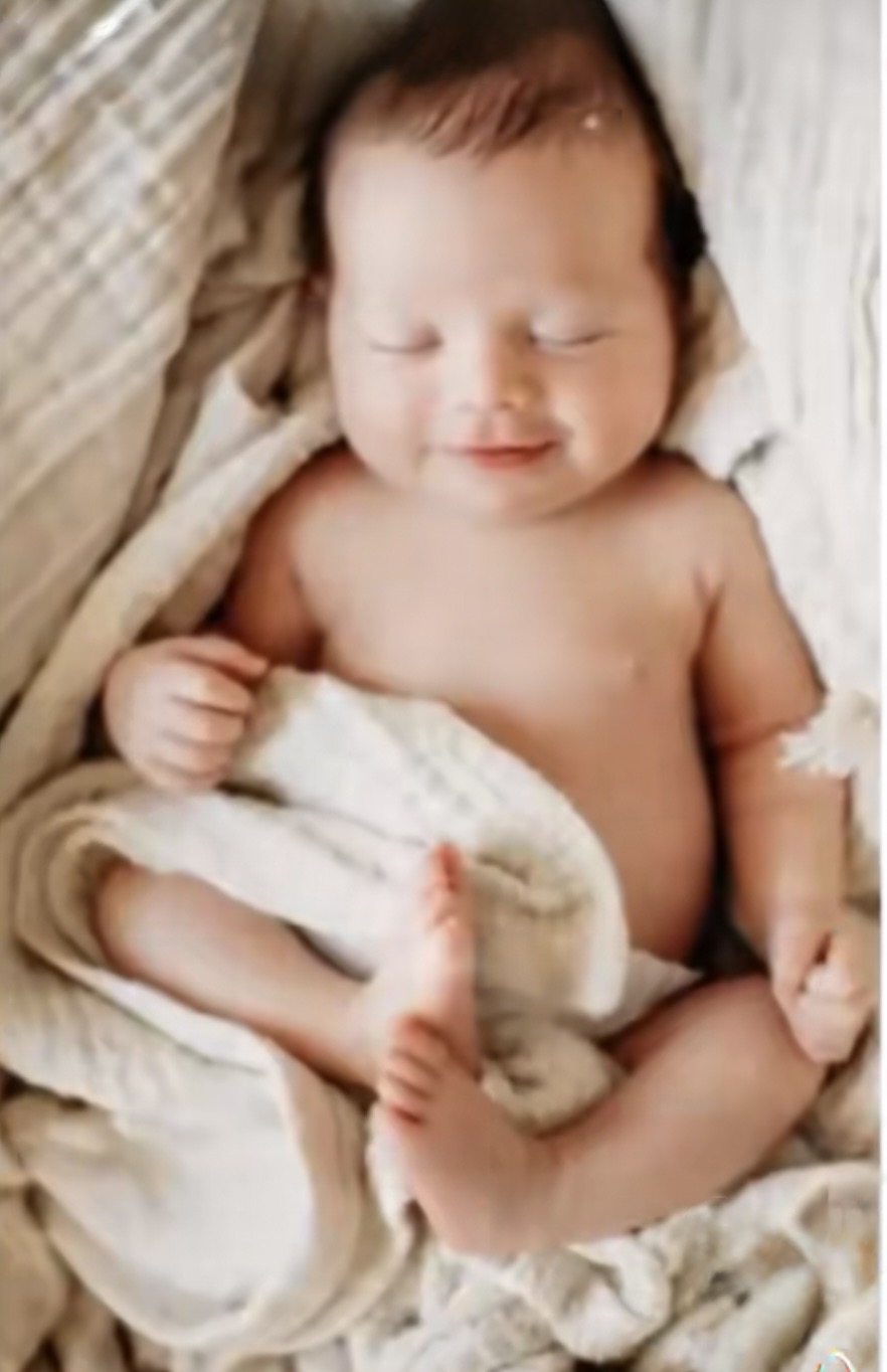 Smiling newborn resting