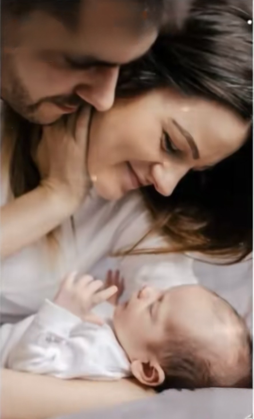 Parents looking at their newborn
